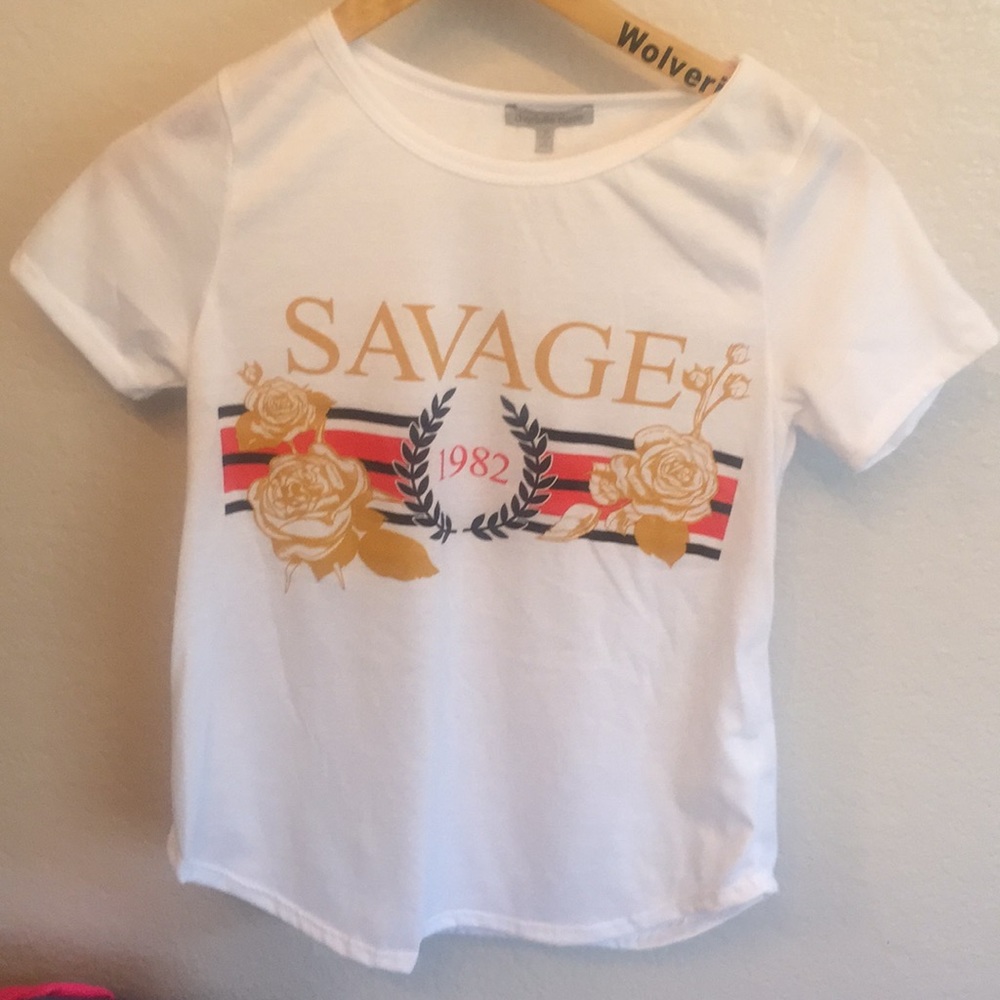 A white T-shirt that has writing on it